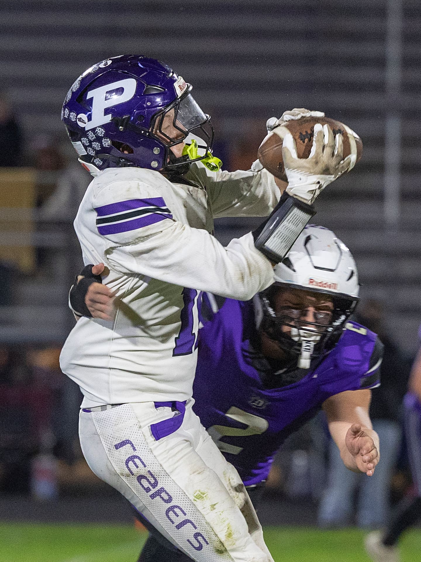 Plano’s Fin Winter hauls in a catch and breaks several tackles to get in the end zone against Dixon Friday, Oct. 23, 2026.