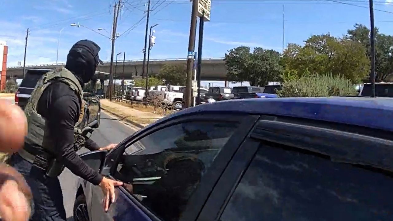 This image made from Immigration and Customs Enforcement (ICE) body camera footage shows an ICE officer stopping Wilber Rafael Garces Perez on Sunday, Sept. 20, 2026, in Austin, Texas. (Immigration and Customs Enforcement via AP)