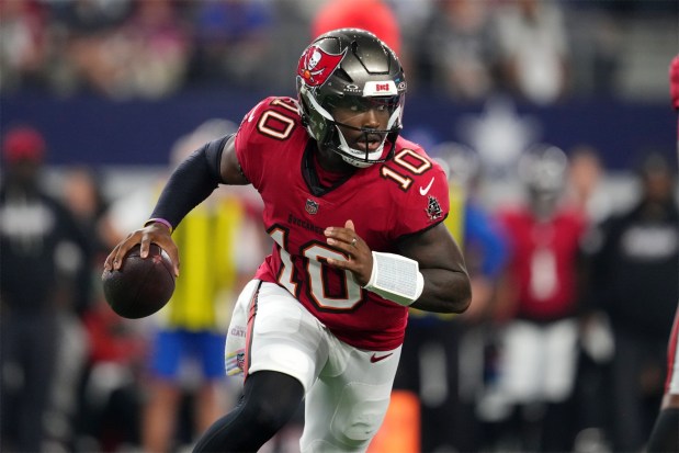Tampa Bay Buccaneers quarterback Jalon Daniels scrambles during the first half of their game against the Dallas Cowboys on Thursday night in Arlington, Texas. (AP Photo/Tony Gutierrez)