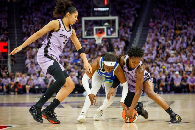 Golden State Valkyries' Kaila Charles (6) and Dallas Wings' Arike Ogunbowale (24) fight for the ball in the third quarter at the Chase Center in San Francisco, Calif., on Thursday, Oct. 2, 2026. (Shae Hammond/Bay Area News Group)