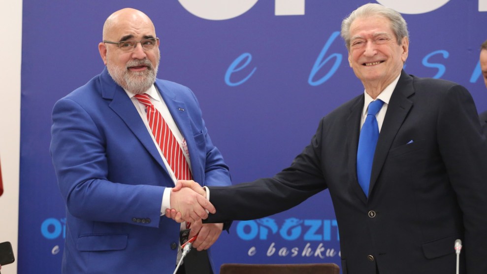Former Trump campaign co-manager Chris LaCivita shakes hands with Albanian opposition leaders Sali Berisha on February 10, 2025 amid campaigning for Albania's parliamentary election.