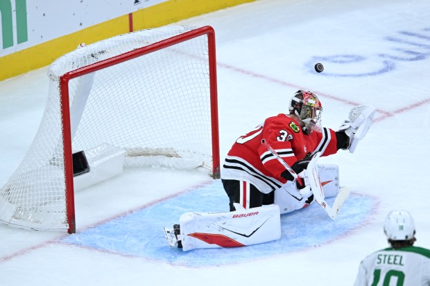 Blackhawks goalie Spencer Knight is scored on by the Stars' Attu Hyry during the second period Saturday, Oct. 17, 2026, at the United Center. (Paul Beaty/AP)