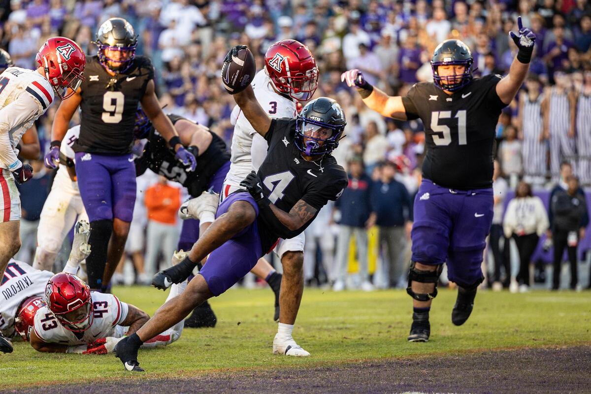 TCU running back Cam Cook (4) celebrates as he scores a touchdown during the second half against Arizona on Nov. 23, 2024, at Amon G. Carter Stadium in Fort Worth.