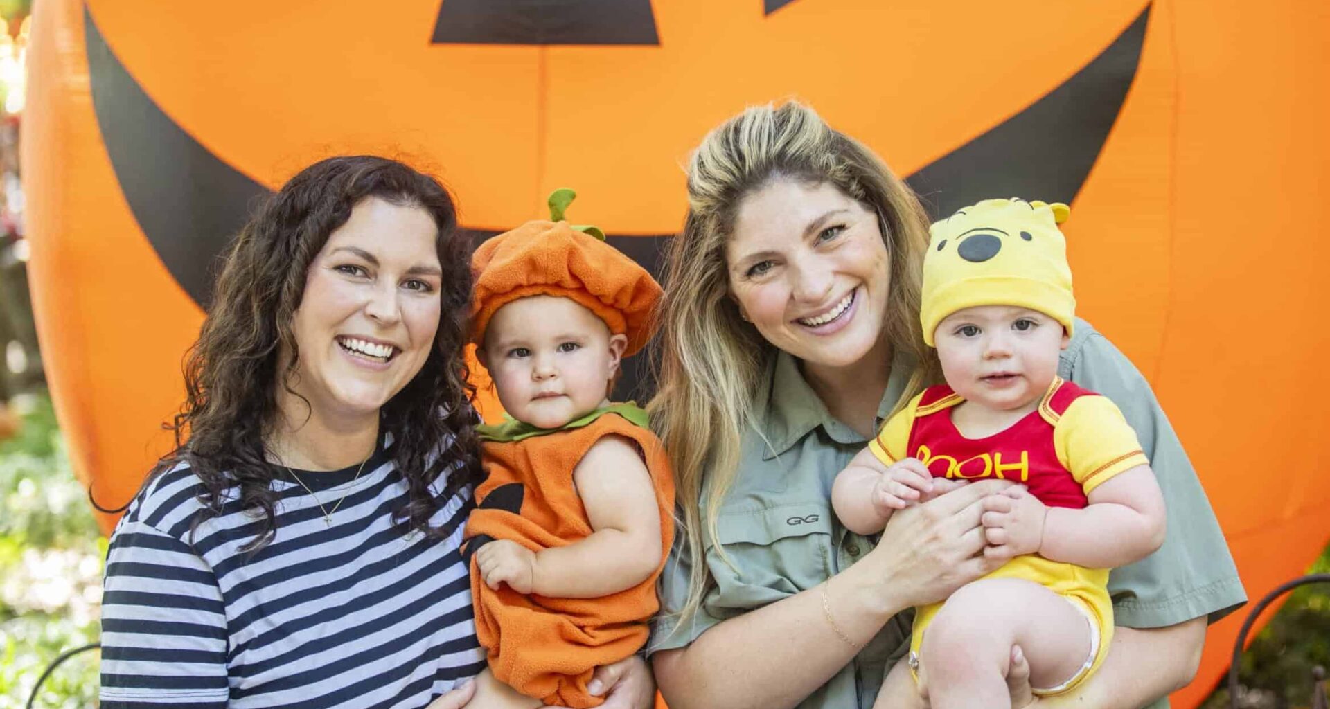 Family with children in Halloween costumes at Boo at the Zoo event.