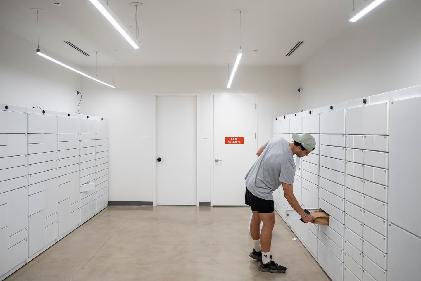 Bisono picked up his packages at his new apartment’s mailroom.