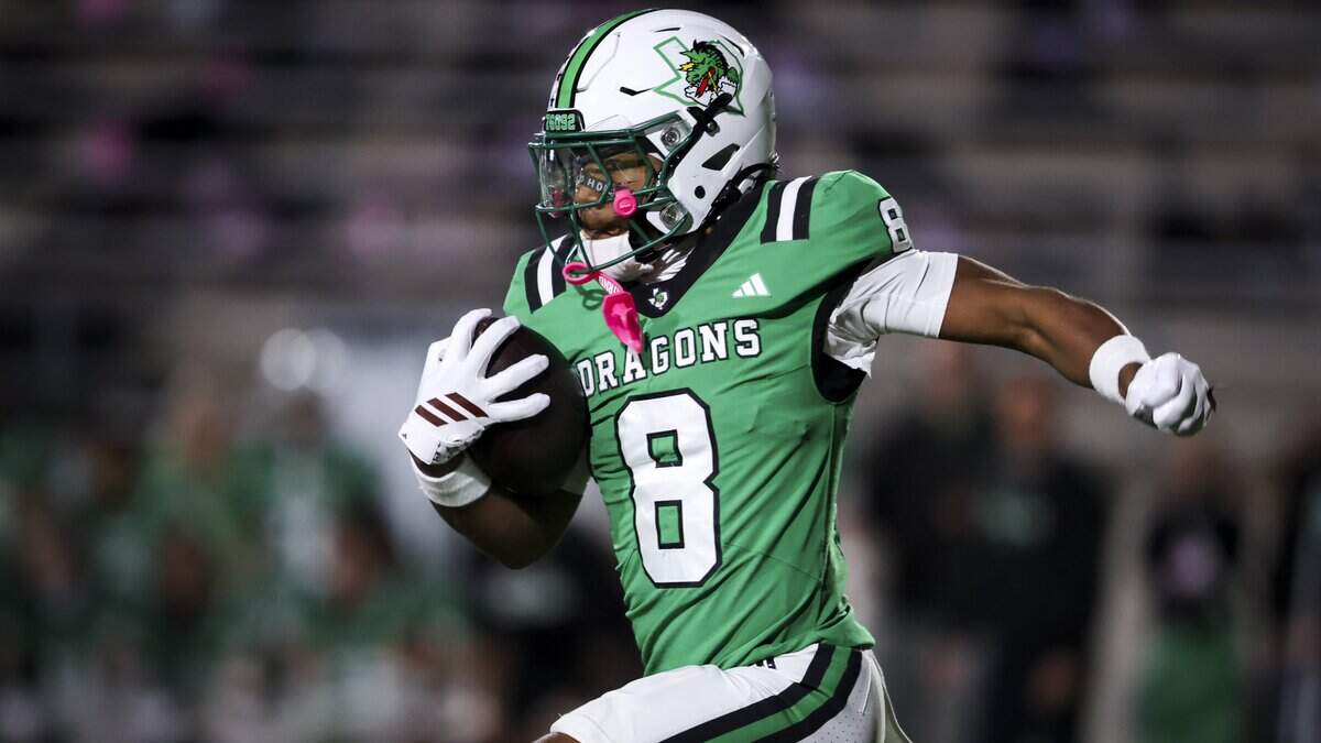 Southlake Carroll wide receiver Dez Bryant Jr. (8) runs the ball during the first half of the game against Keller on Friday, Oct. 16, 2026, at Dragon Stadium in Southlake.