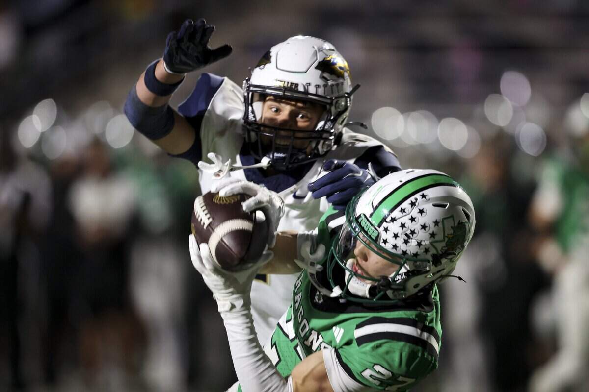 Southlake Carroll defensive back Parker Olson (27) intercepts the ball during the first half of the game against Keller on Friday, Oct. 16, 2026, at Dragon Stadium in Southlake.