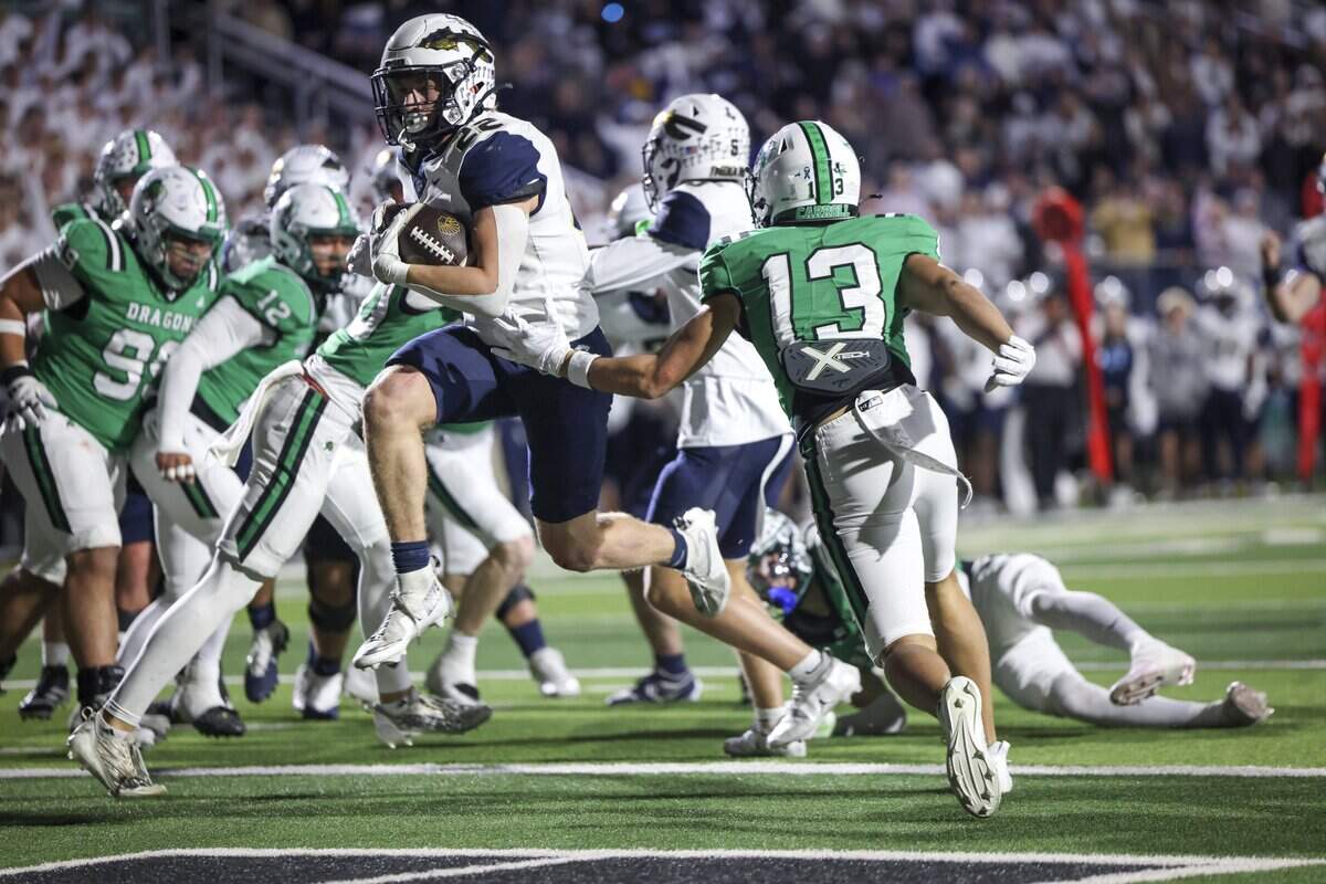 Keller running back Blake Dyniewski (22) scores a touchdown during the second half of the game against Southlake Carroll on Friday, Oct. 16, 2026, at Dragon Stadium in Southlake.