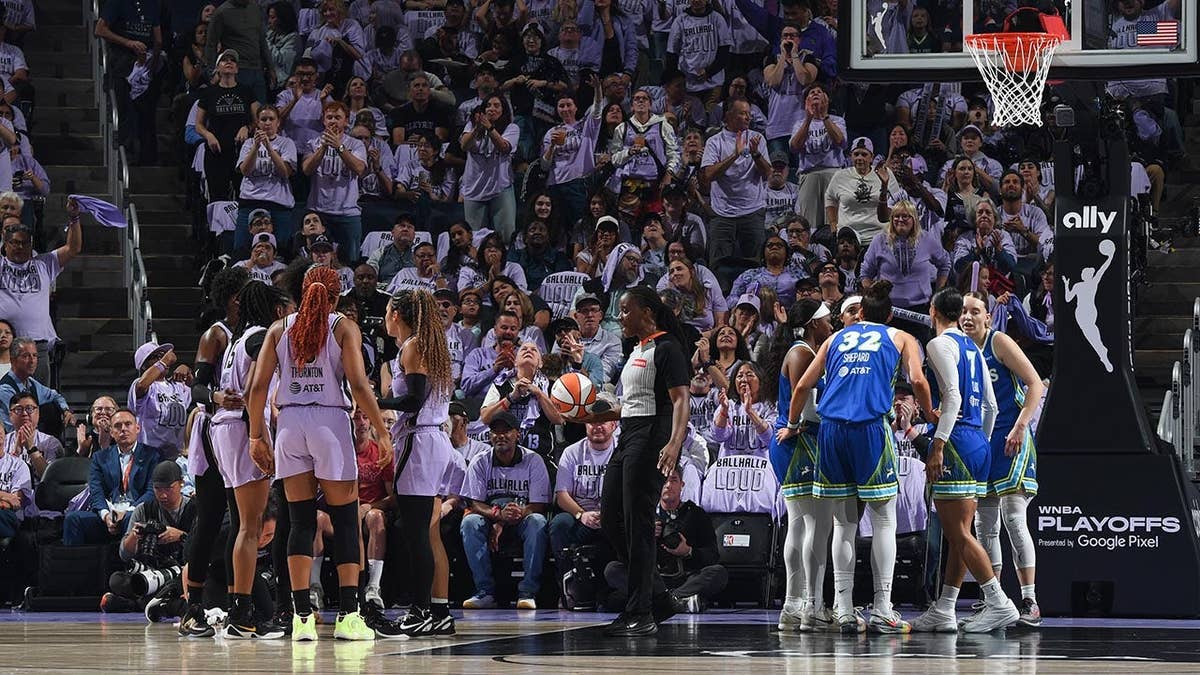 Golden State Valkyries and Dallas Wings huddle during a WNBA playoff game