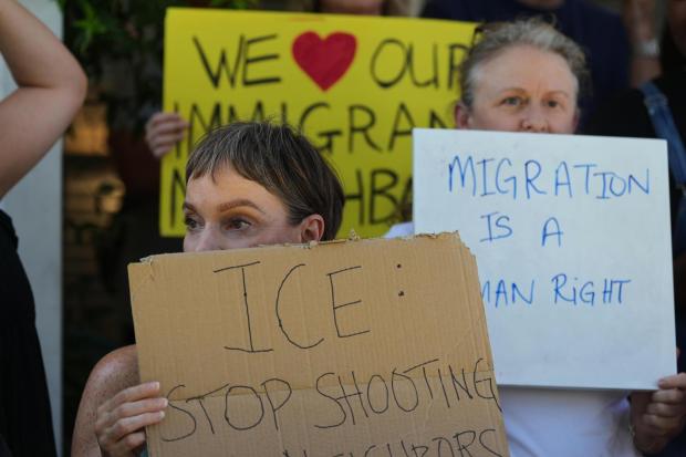Supporters gather around a news conference for Wilber Rafael Garces Perez, a Venezuelan man shot by an ICE officer, at the offices of attorney Kate Lincoln-Goldfinch, in Austin, Texas, Monday, Sept. 21, 2026. (AP Photo/Eric Gay)