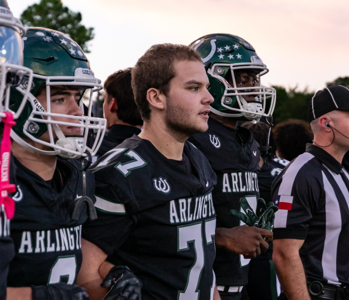 Sam Soto walks out as an honorary captain at a September football game.