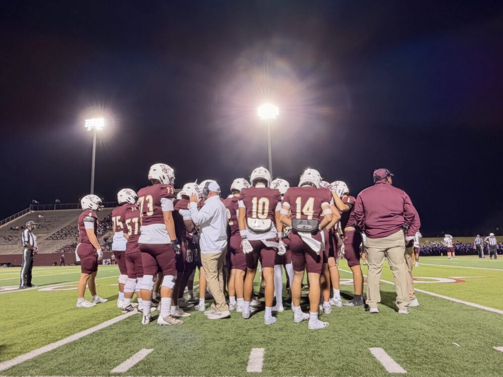 Deer Park High School Football game and team huddle
