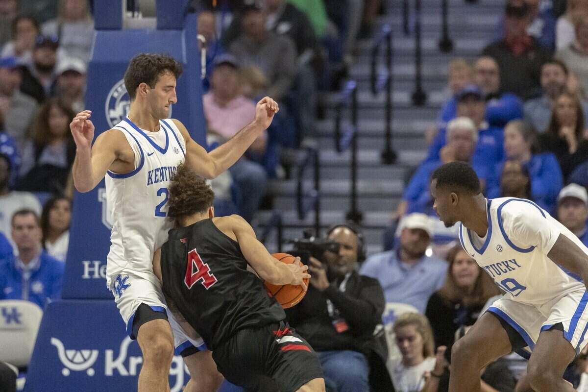 Kentucky forward Milan Momcilovic (22) defends Texas Tech guard Dra Gibbs-Lawhorn (4) during a game at Rupp Arena on Friday. The Wildcats’ defenisve length gave the Red Raiders problems.