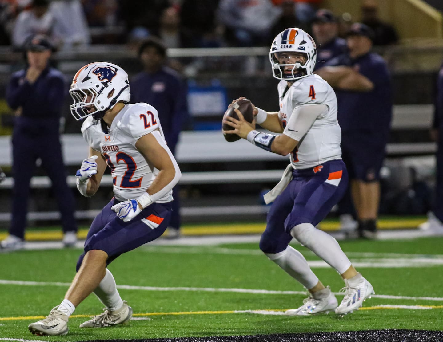 Oswego's Graham Schwab (22) stays back to block for Drew Kleinhans (4) during football game between Oswego and Joliet West. Friday, Oct, 2 2026 in Joliet.