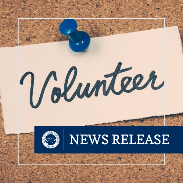 News release graphic featuring a cork board with the word Volunteer pinned to it