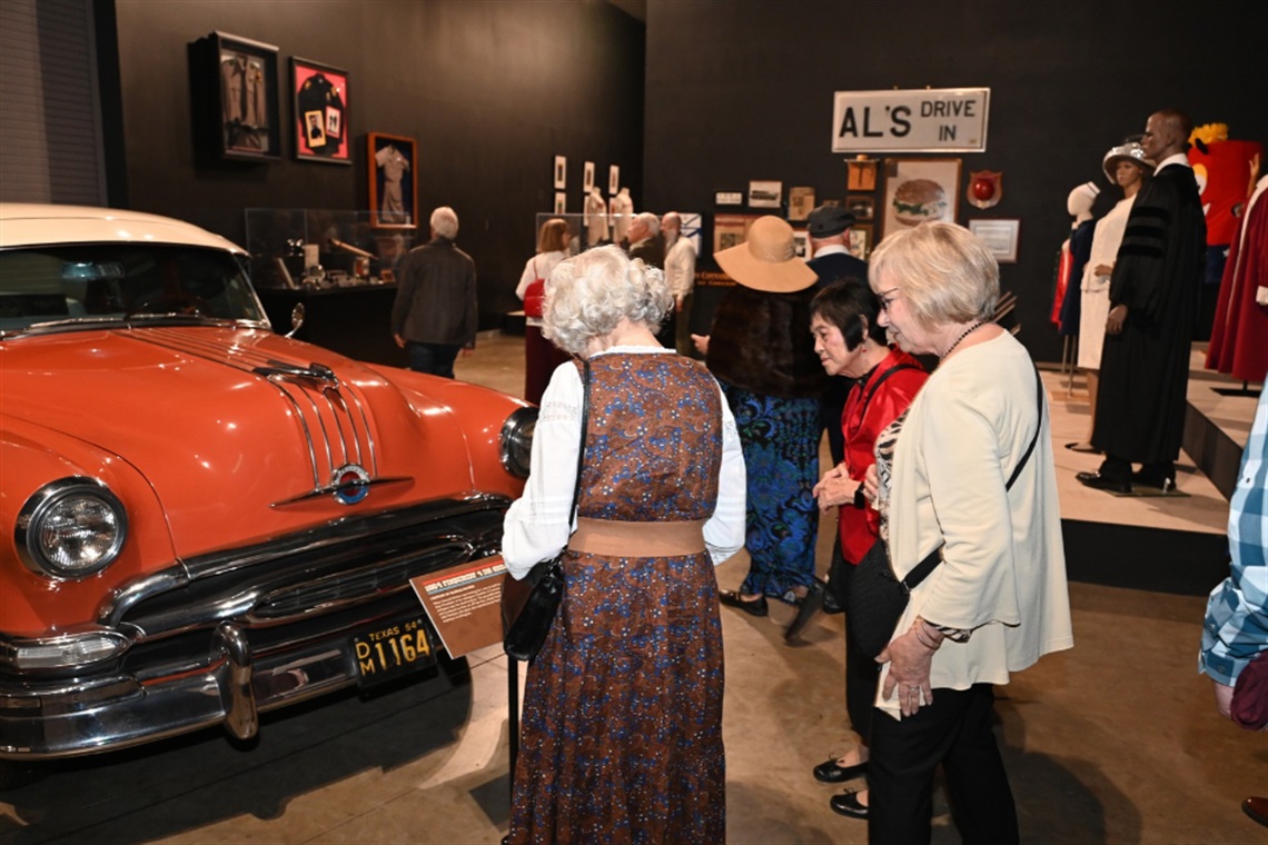 Residents look at Arlington historical memorabilia at the Arlington Museum of Art on Oct. 16, 2026.