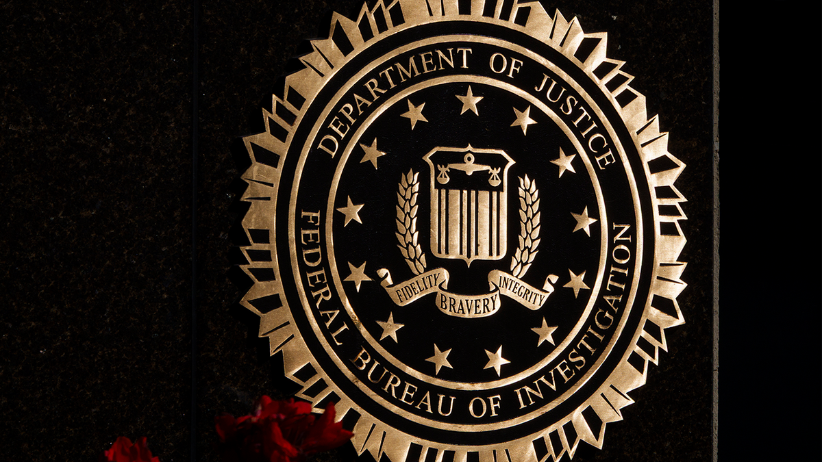The seal of the Federal Bureau of Investigation (FBI), part of the U.S. Department of Justice, is displayed at the J. Edgar Hoover Building on August 8, 2026 in Washington, DC.