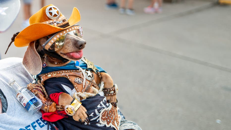 Robert Ankrum and his dog Buttercup enjoy attractions at the State Fair of Texas on September 26, 2025, in Dallas, Texas.