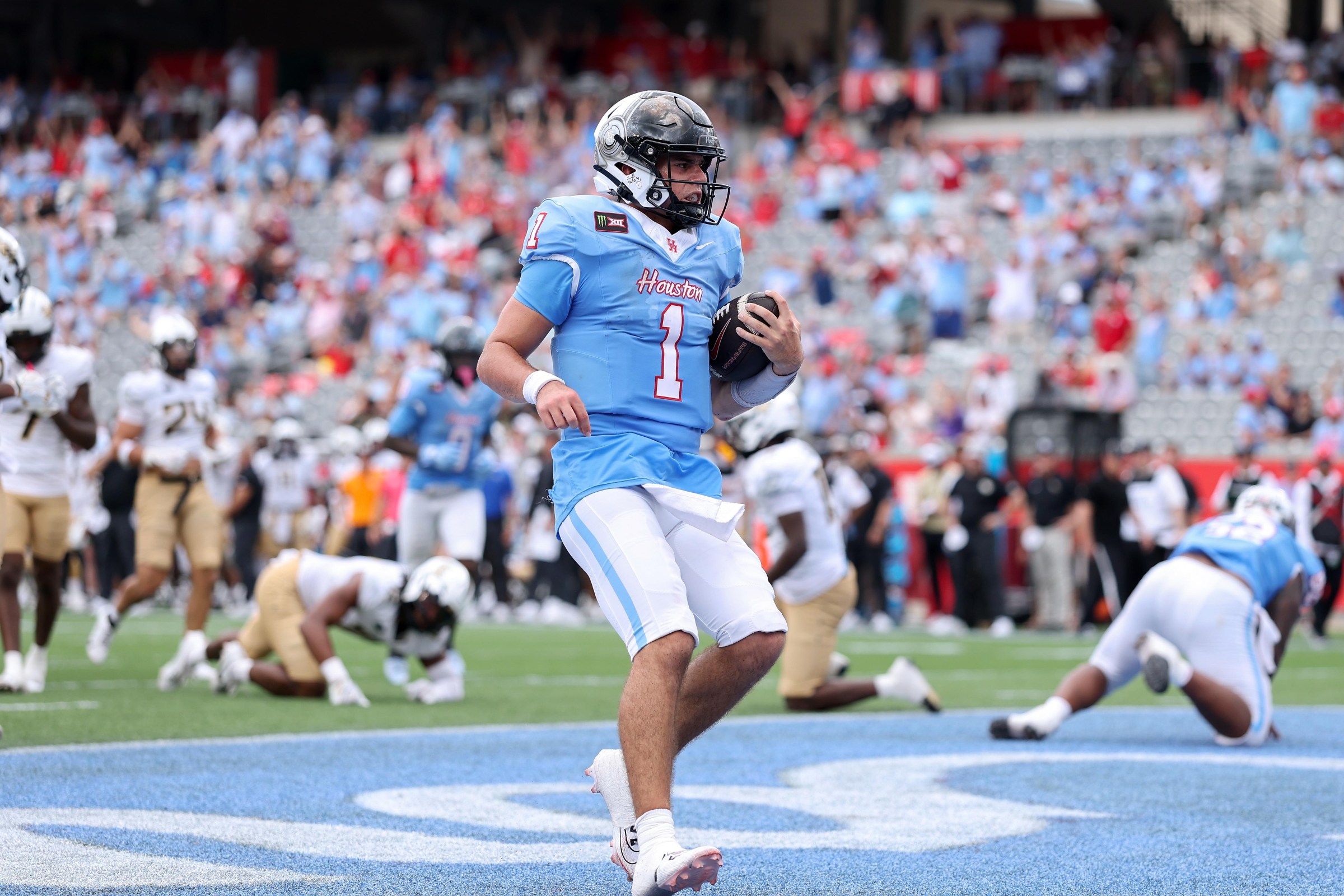 HOUSTON, TEXAS - OCTOBER 03: Conner Weigman #1 of the Houston Cougars scrambles for a touchdown in the second half against the UCF Knights at TDECU Stadium on October 03, 2026 in Houston, Texas. (Photo by Tim Warner/Getty Images)