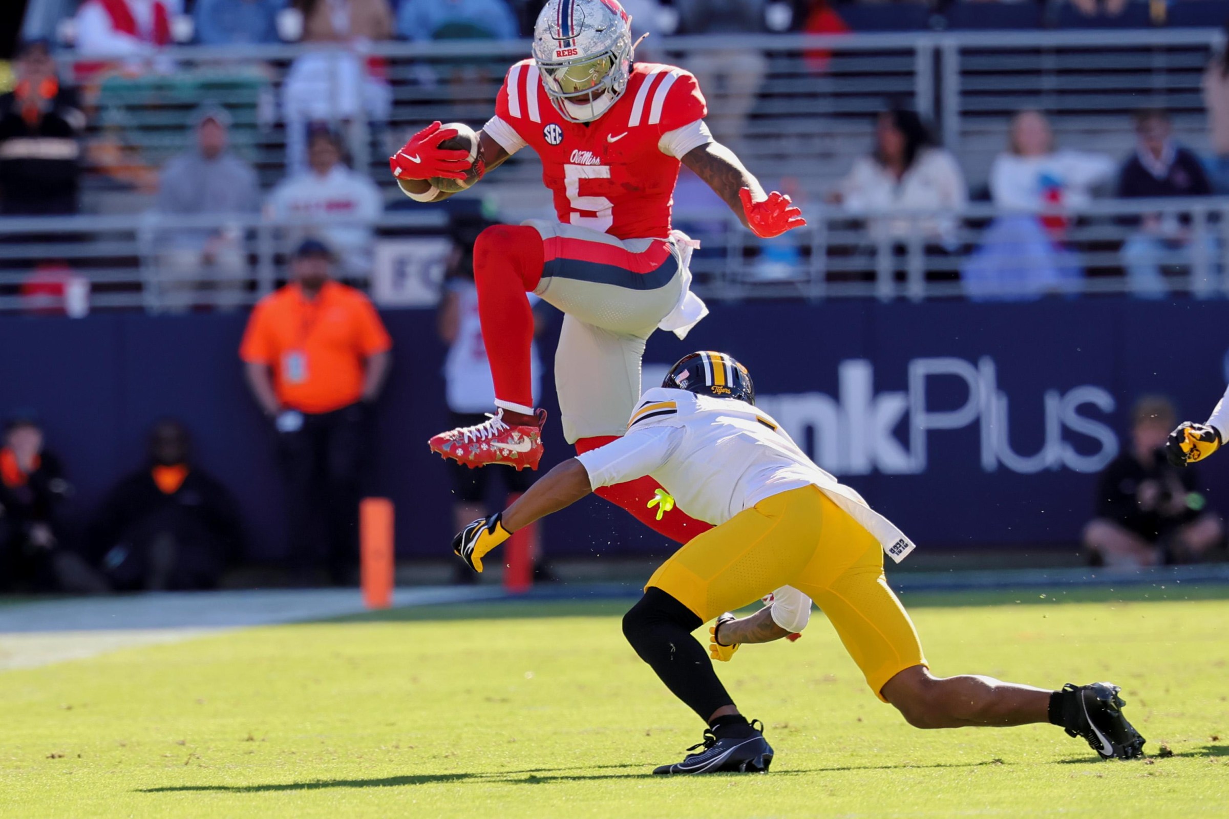 OXFORD, MS - OCTOBER 17: Ole Miss Rebels running back Kewan Lacy (5) leaps over a Missouri defender during the game between the Ole Miss Rebels and the Missouri Tigers on October 17, 2026 at Vaught-Hemingway Stadium in Oxford, MS. (Photo by Jason Homan/Icon Sportswire via Getty Images)