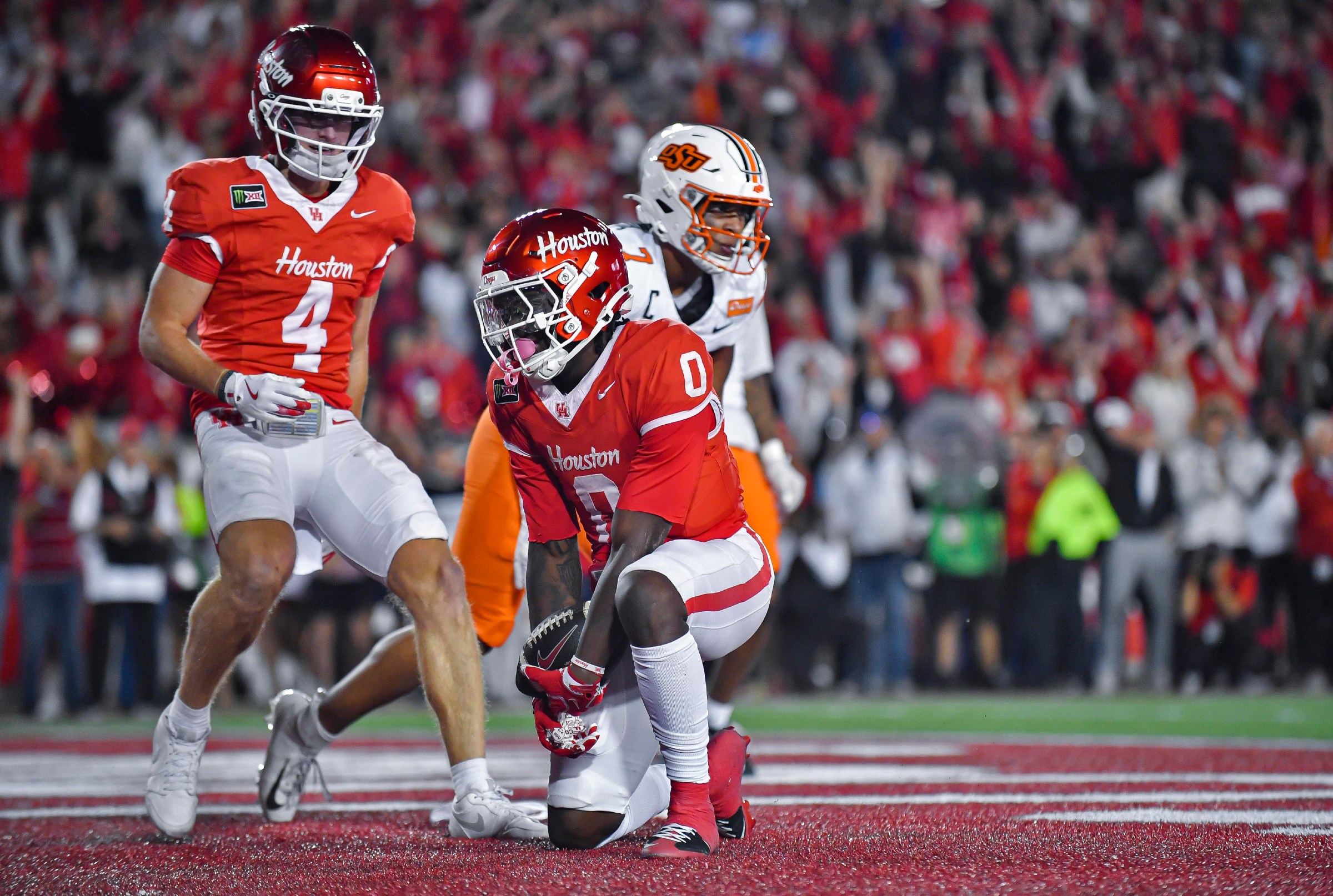 HOUSTON, TX - OCTOBER 17: Houston Cougars receiver Amare Thomas (0) gets back on his feet after scoring a second quarter touchdown in a college football game between the Oklahoma State Cowboys and Houston Cougars on Saturday, October 18, 2026 at TDECU Stadium in Houston, TX. (Photo by Austin McAfee/Icon Sportswire via Getty Images)