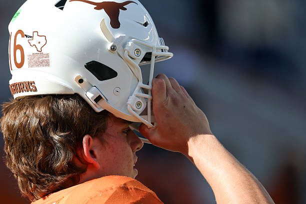 AUSTIN, TX - OCTOBER 17: Texas Longhorns quarterback Arch Manning #16 readies to pull his helmet onto his head ahead of the SEC football game between the Texas Longhorns and Florida Gators on October 17, 2026, at Darrell K Royal-Texas Memorial Stadium in Austin, TX. (Photo by David Buono/Icon Sportswire via Getty Images)