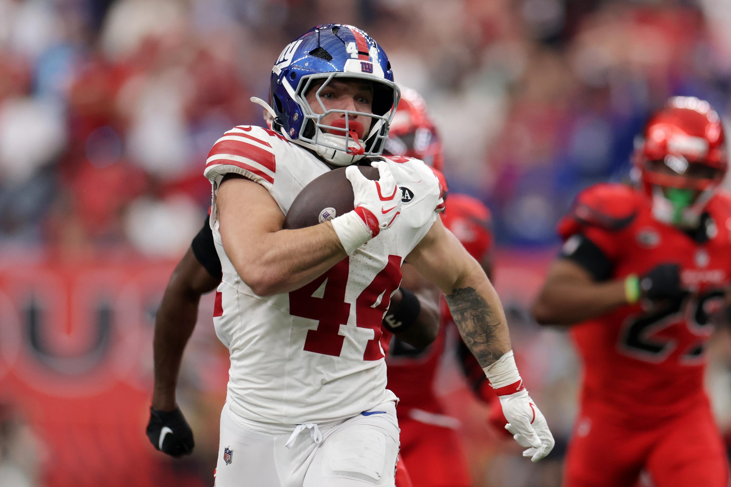 HOUSTON, TEXAS - OCTOBER 25: Cam Skattebo #44 of the New York Giants runs the ball against the Houston Texans in overtime at NRG Stadium on October 25, 2026 in Houston, Texas. (Photo by Kenneth Richmond/Getty Images)