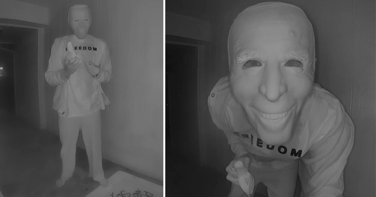 Unknown individual eats banana through Joe Biden mask in Watauga doorbell camera video