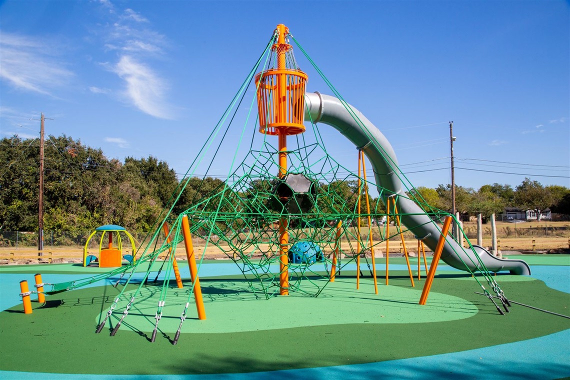 Playground with climbing ropes and slide at Meadowbrook Park