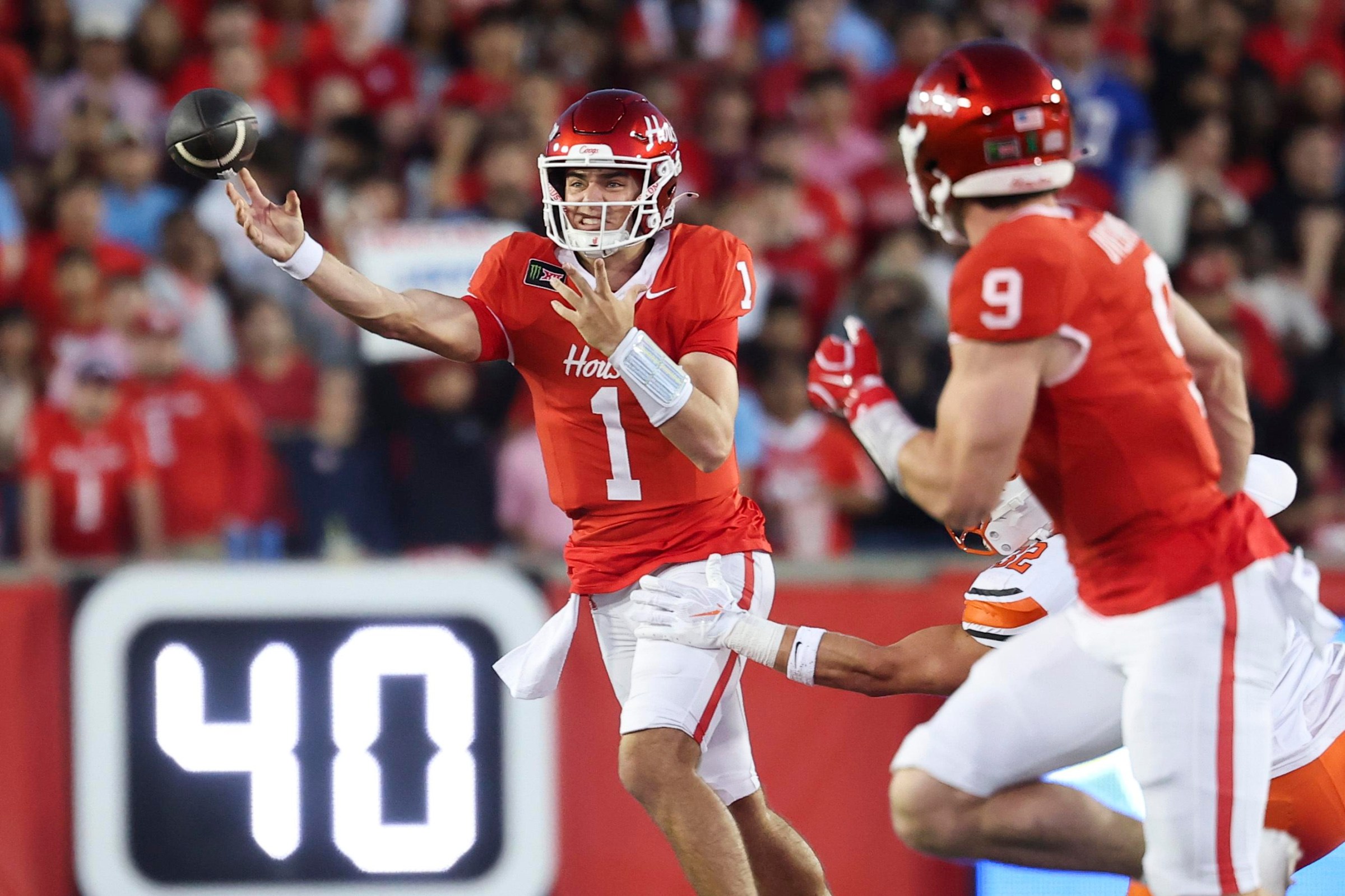 Oct 17, 2026; Houston, Texas, USA; Houston Cougars quarterback Conner Weigman (1) passes the ball to tight end Patrick Overmyer (9) during the first quarter against the Oklahoma State Cowboys at TDECU Stadium. Mandatory Credit: Troy Taormina-Imagn Images