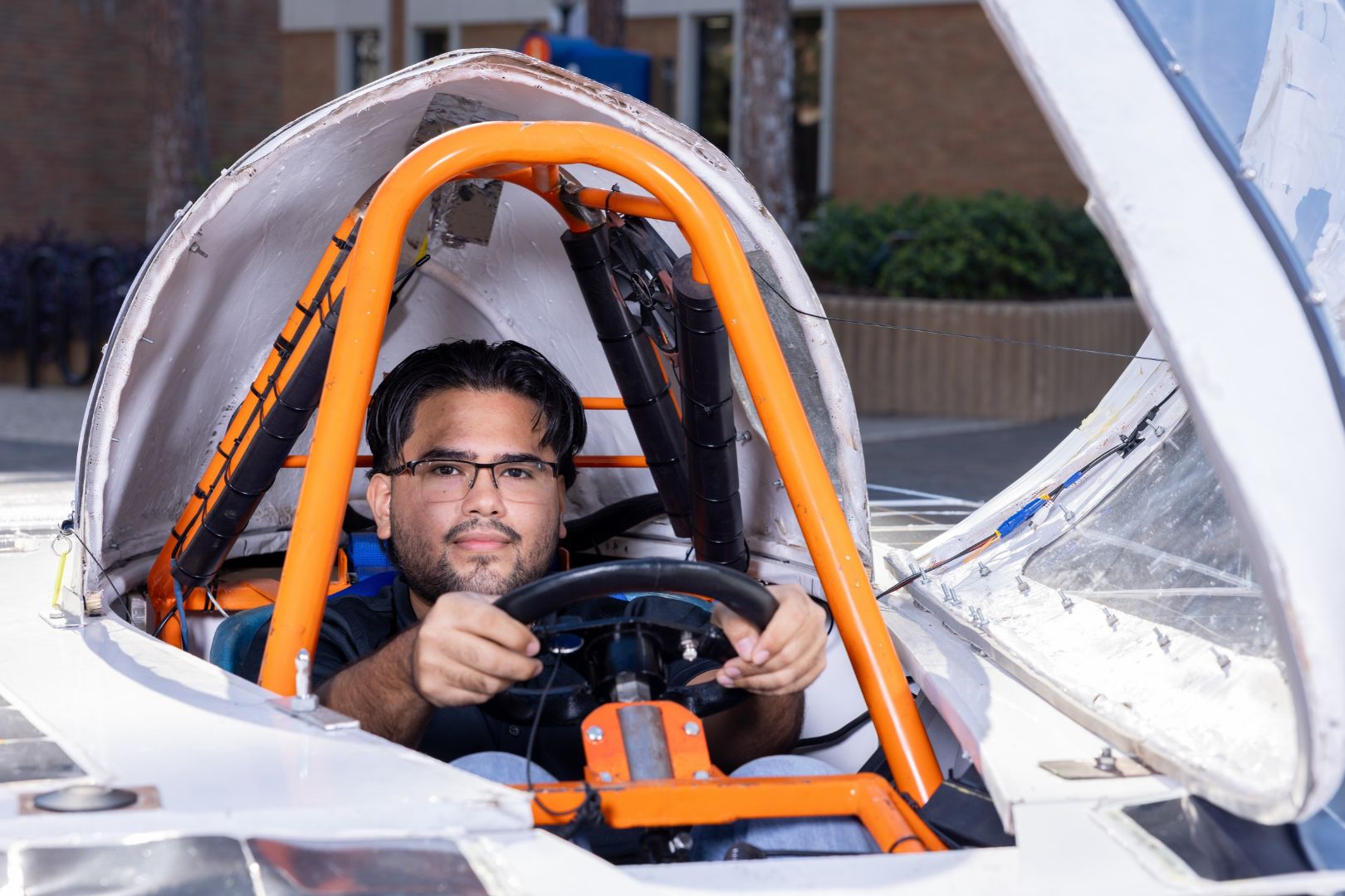 Image shows UTA Blaze Raycers team member inside the solar car " style=" height:1080px; width:1620px" _languageinserted="true" src="https://cdn.prod.web.uta.edu/-/media/project/website/news/releases/2026/10/solar-inside.jpg