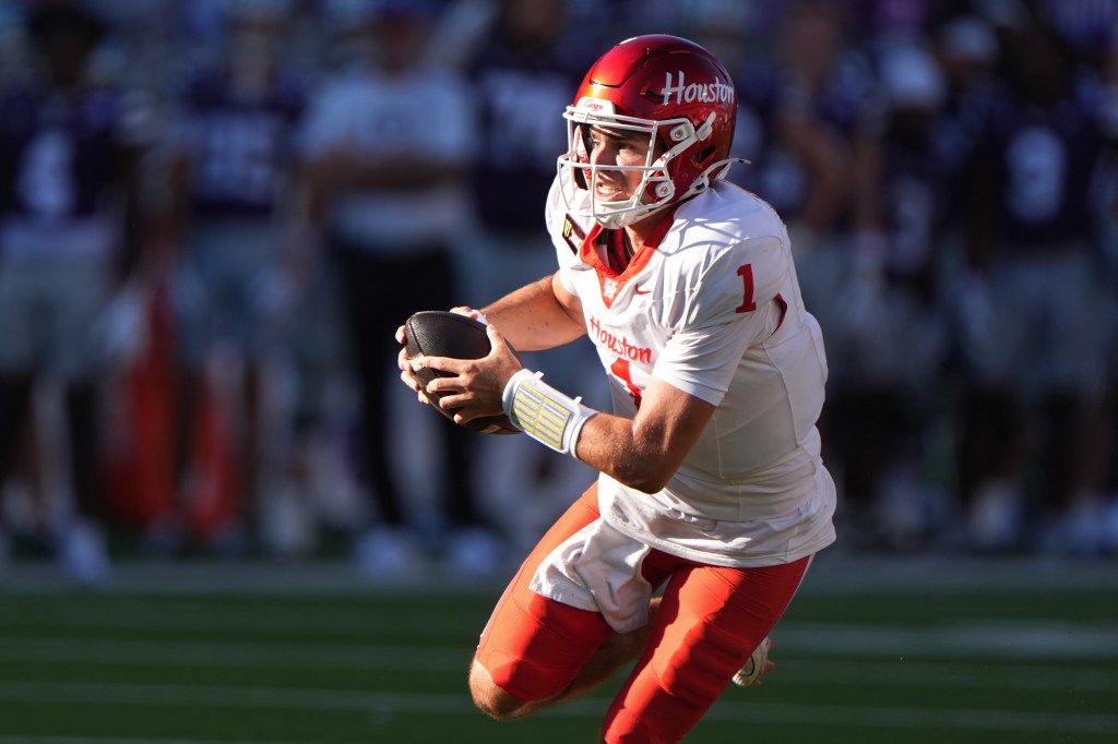 Houston quarterback Conner Weigman runs with the football during a game against Kansas State.