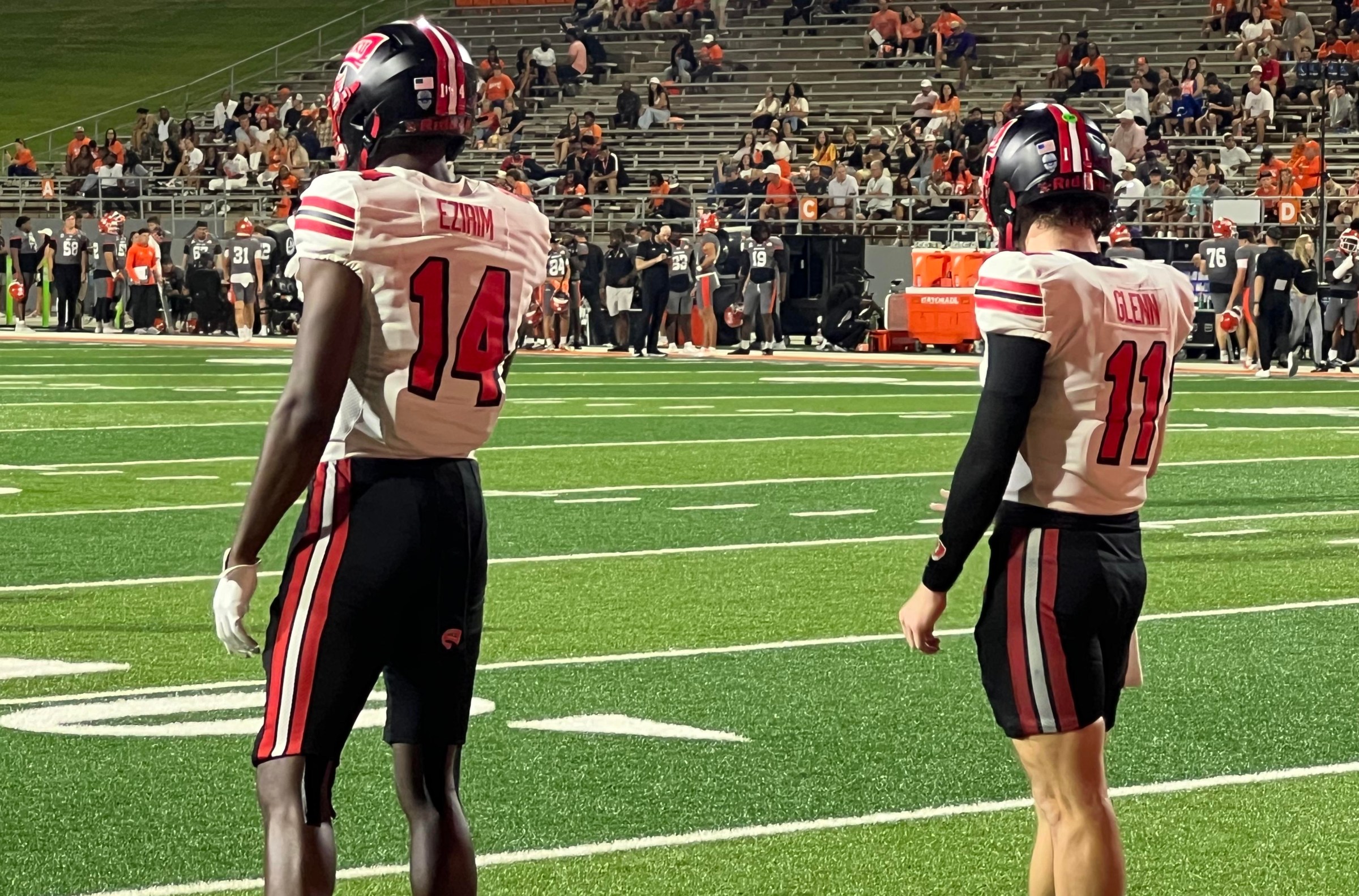 WKU TE CC Ezirim and QB Brock Glenn warm up on the sidelines during an Oct. 14, 2026 game at Sam Houston.