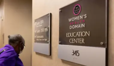 Photo of a plaque by a door in a hospital. The plaque reads "Women's Health Domain Education Center."