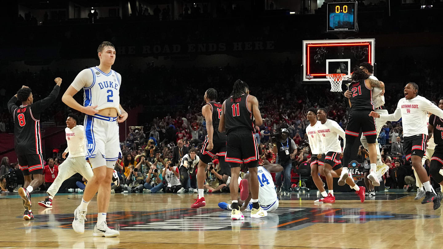 Apr 5, 2025; San Antonio, TX, USA; Duke Blue Devils forward Cooper Flagg (2) walks off the court as Houston Cougars players celebrate after Houston’s semifinal win in the men's 2025 NCAA tournament at Alamodome. Mandatory Credit: Bob Donnan-Imagn Images
