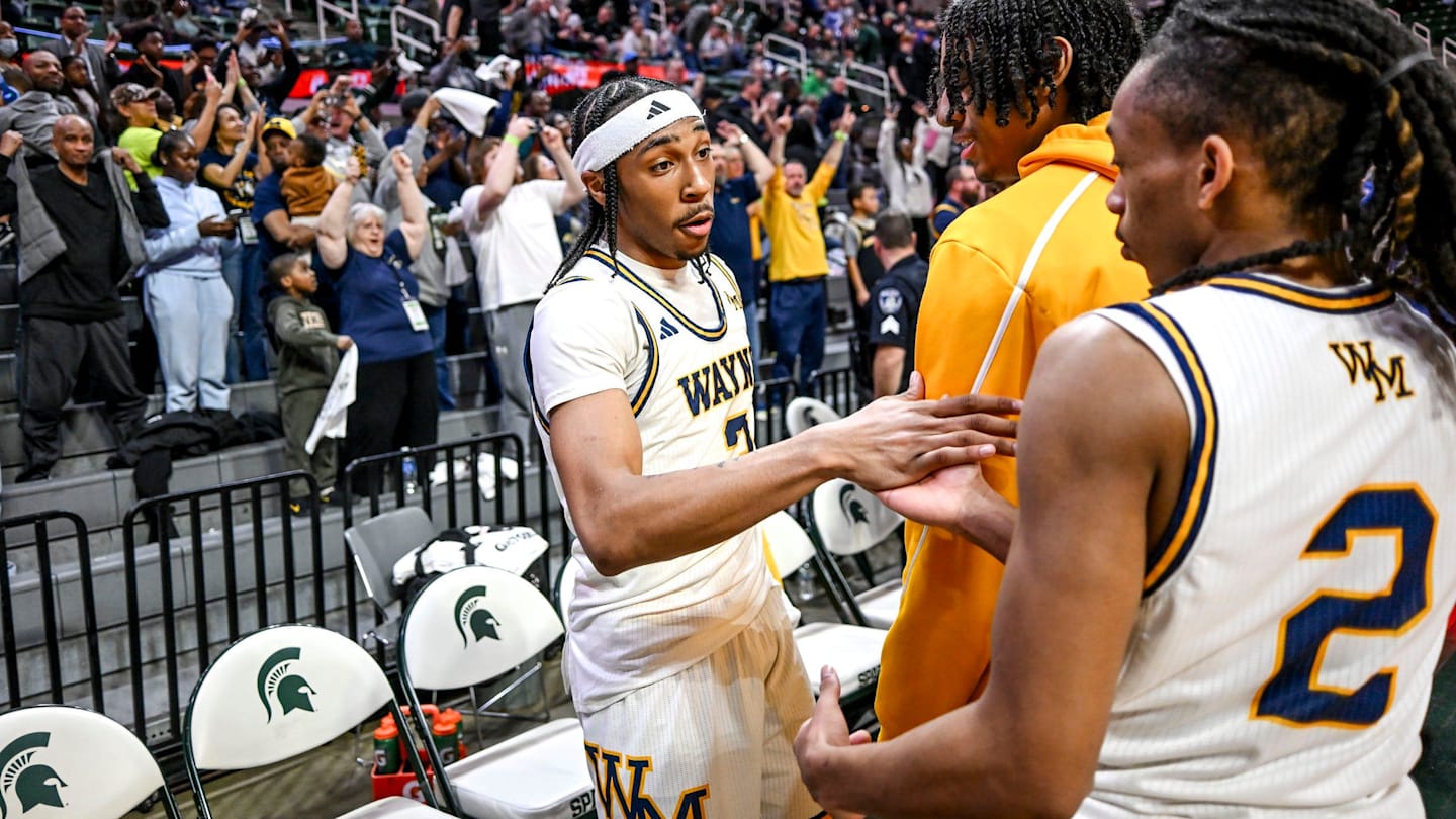 Wayne Memorial's Carlos Medlock Jr., left, shakes hands with Jalahn McClellan after beating Flint Carman-Ainsworth in the Division 1 state semifinal on Friday, March 14, 2025, at the Breslin Center in East Lansing.