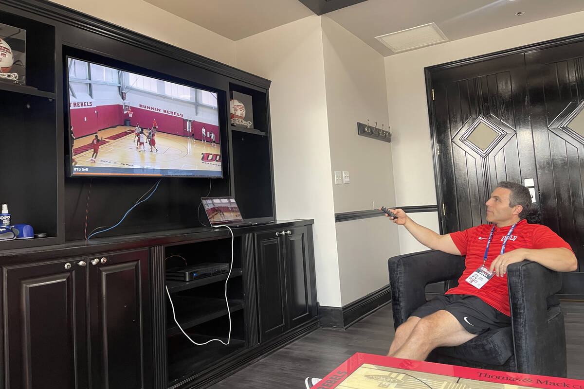 UNLV basketball coach Josh Pastner watches film in his office. (Callie Fin/Las Vegas Review-Jou ...