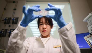 A researcher from Mandai Wildlife Group holds up a tray of cells extracted from a cold-blooded animal.