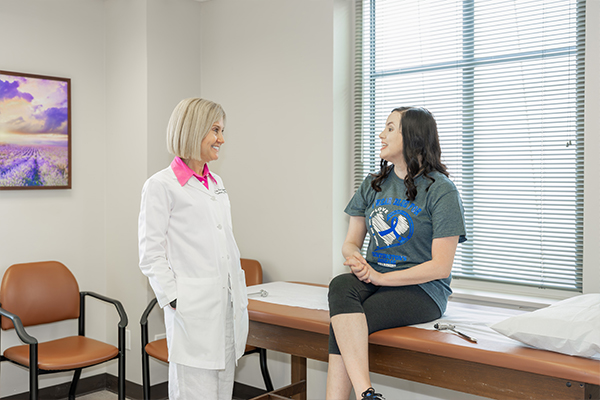 Erin Furr Stimming with Kelsea Turnbull in the exam room following her Huntington's disease diagnosis