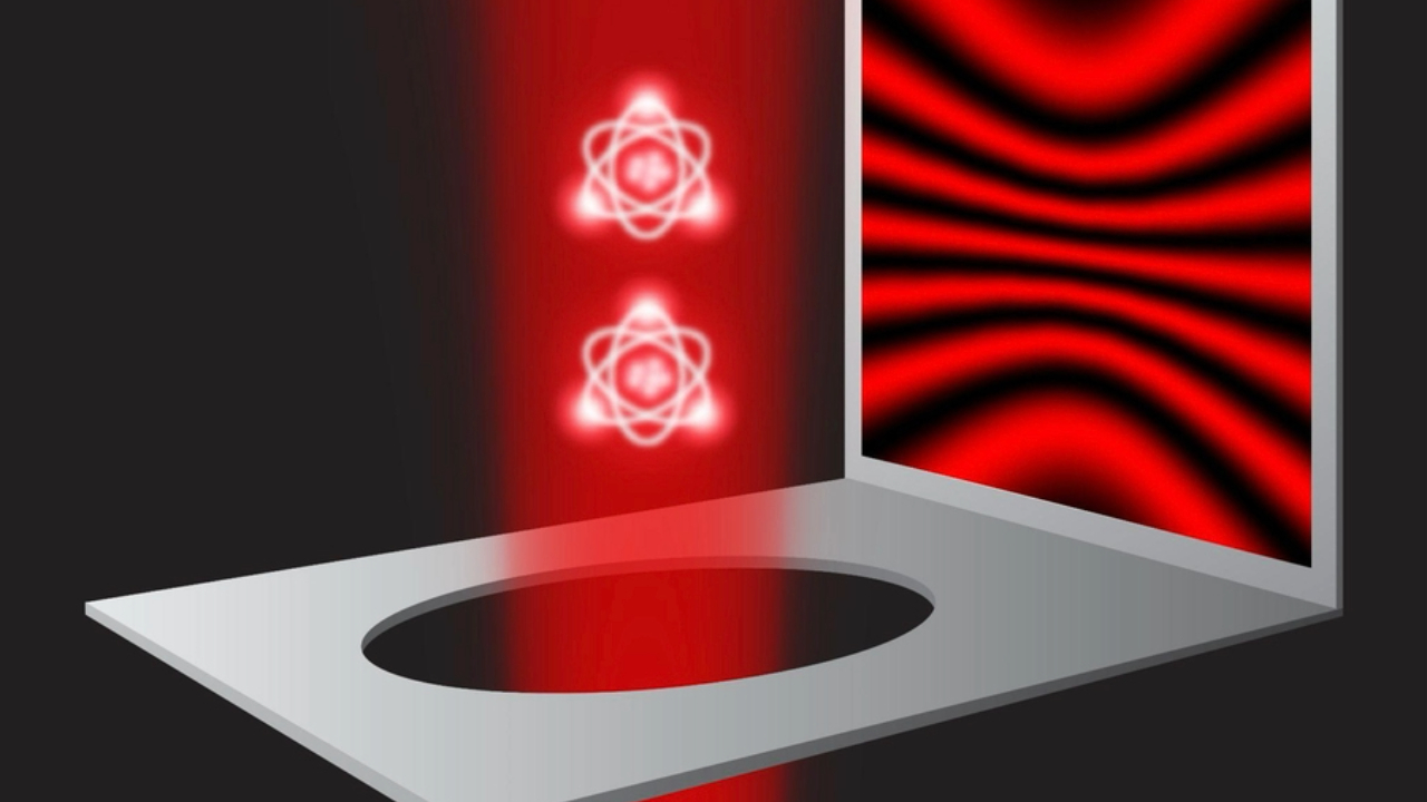 An illustration of two atoms in a beam of red light floating through a hole in a metal surface while a diffraction pattern of red and black light is next to them