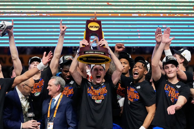 Florida celebrates with the trophy after their win against the Houston in the national championship.