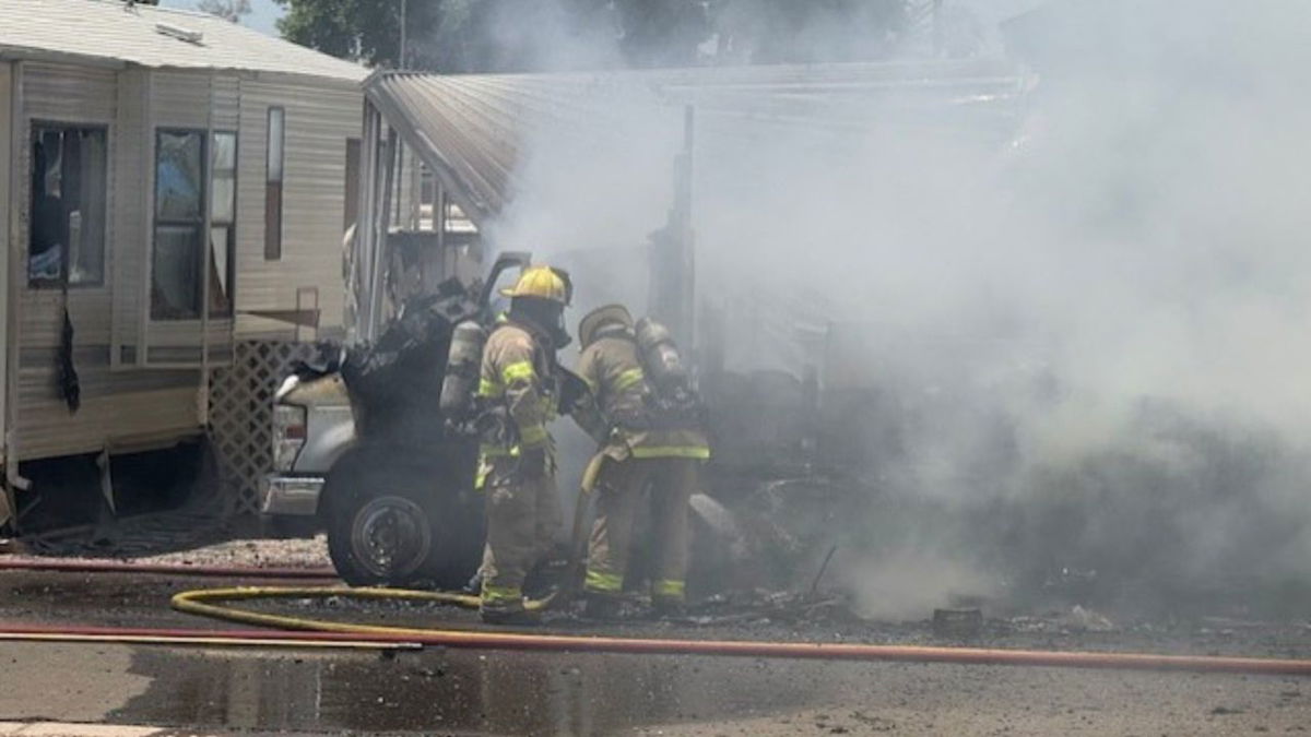 Fire crews in battle RV fire on Eighth Street