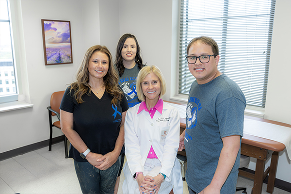Erin Furr Stimming with Turnbull family in the exam room for Huntington's disease treatment