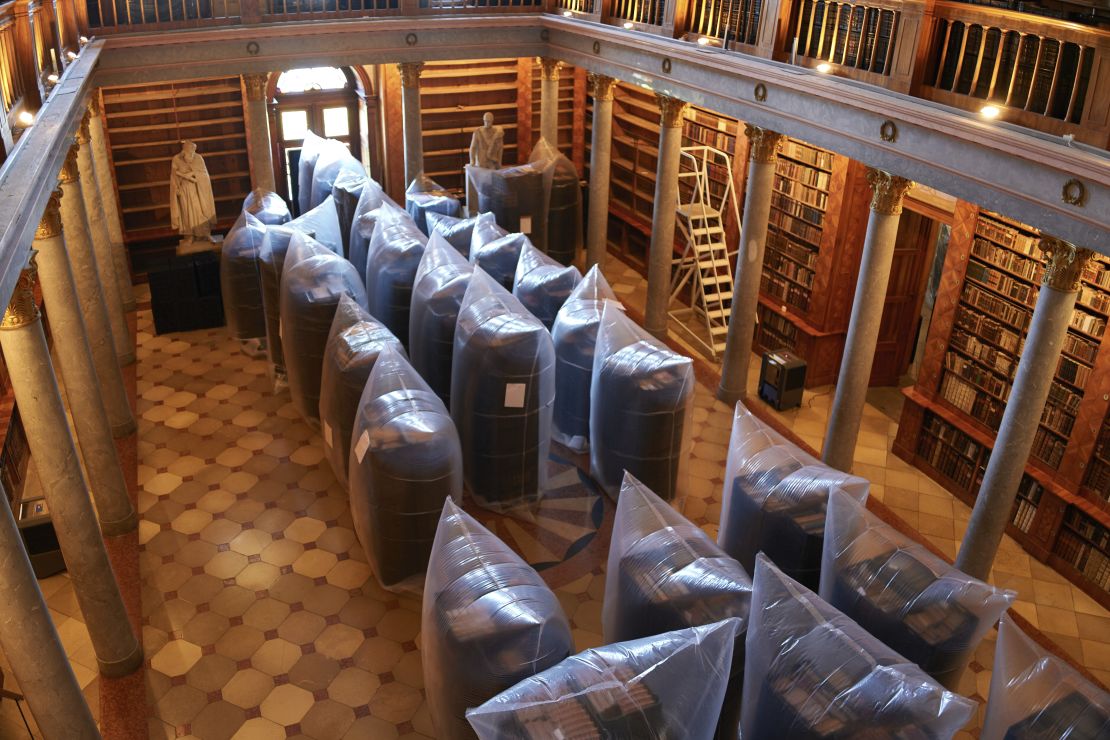 Books are kept in hermetically sealed plastic sacks for disinfection, at the Pannonhalma Archabbey's library in Pannonhalma, Hungary, Thursday, July 3, 2025, as a beetle infestation threatens its ancient collection.