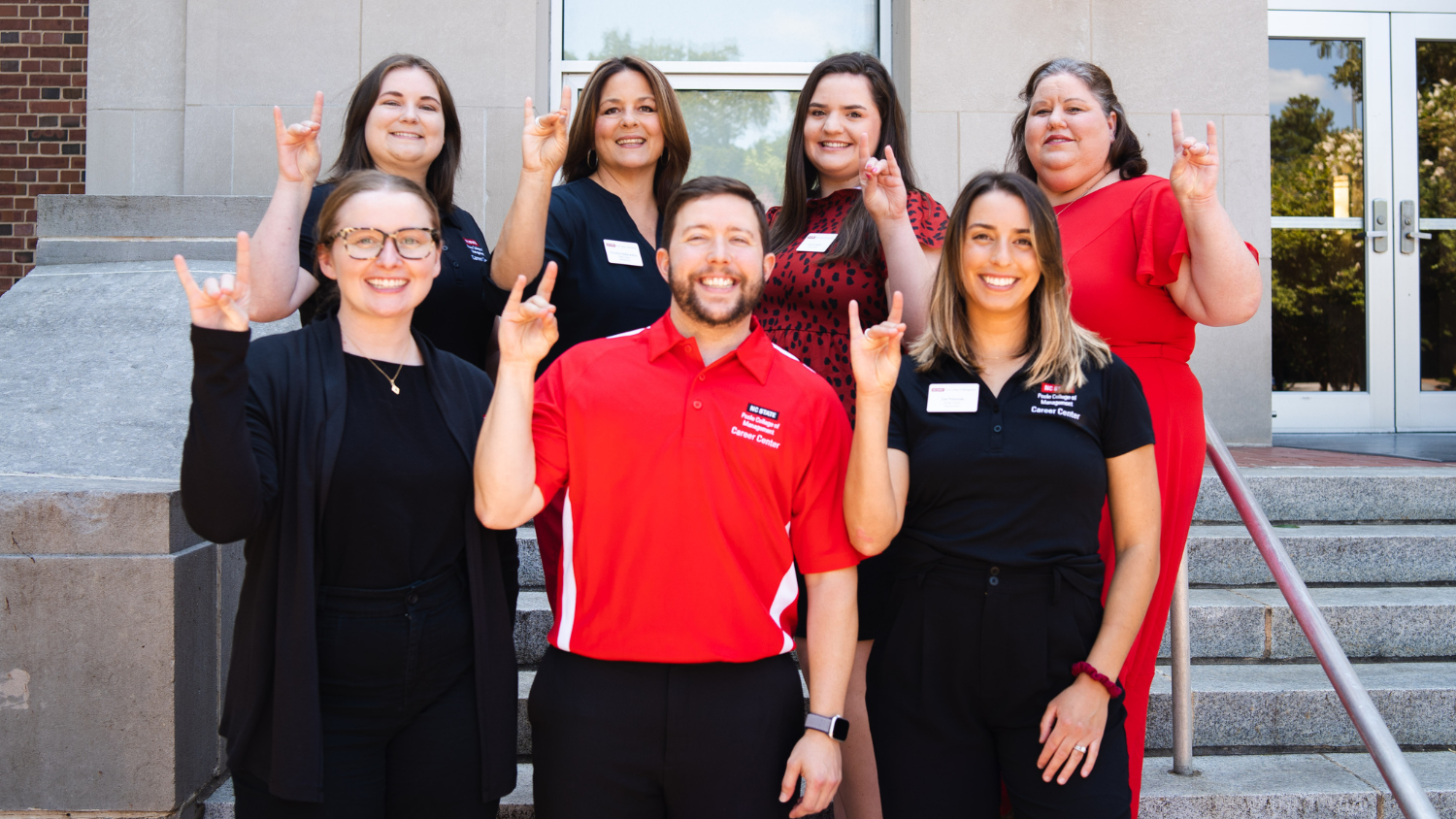 Poole Career Center team making wolfpack sign