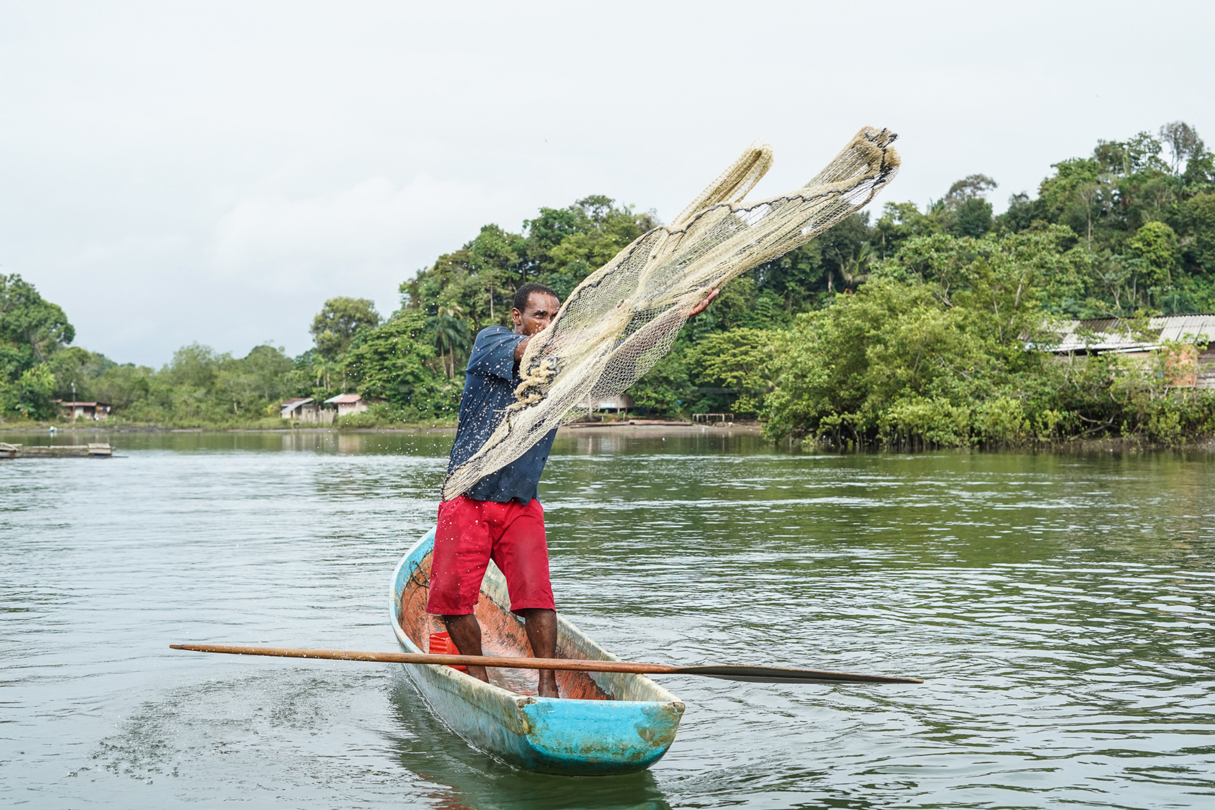 An Afro-descendant man fishes in the river in Colombia. Credit: Conservation International