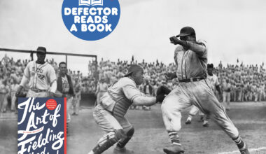 Defector Reads A Baseball Book