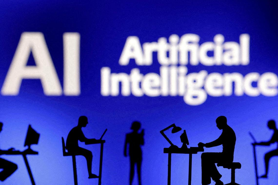 FILE PHOTO: Figurines with computers and smartphones are seen in front of the words "Artificial Intelligence AI" in this illustration created on February 19, 2024. REUTERS/Dado Ruvic/Illustration/File Photo
