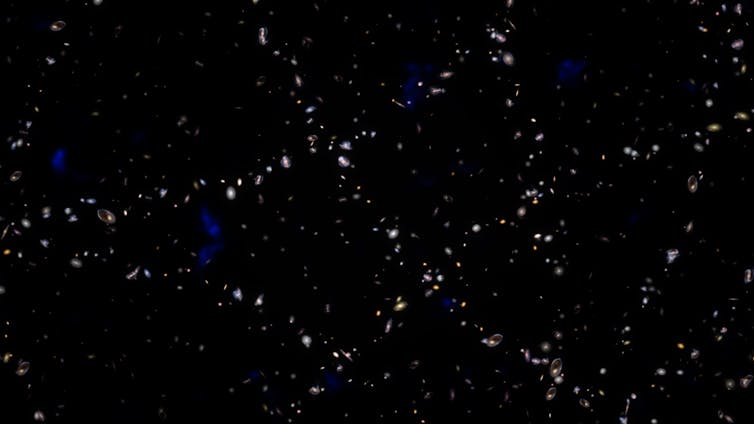 Illustration showing that slightly more galaxies formed along the ripples of the primordial sound waves  than elsewhere. Then the rings of galaxies stretched with the expansion of the universe.