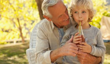 An adult and a child with a bottle of cola.